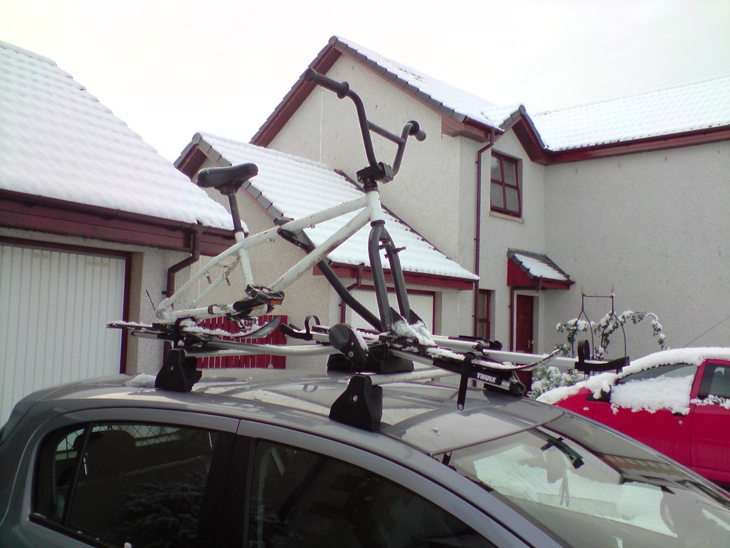 snow bike fits on rack as bonnie as you like.