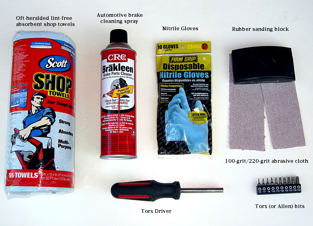 What you need: dedicated shop towels are a good idea because aerosol brake cleaner will eat additives and plastics in cloth or parer-type napkins and could cause more trouble. Eye protection is a good idea too when using chemicals. We show you the tools necessary to remove Magura brake pads. You'll need a slightly different kit to remove other types of pads. Finally. we used 100-grit abrasive because it gets the job done quickly. If your rotors use a spider, then make a sanding block from a paint stirring stick or similar, or carefully work the rotor with the edge of the rubber block.