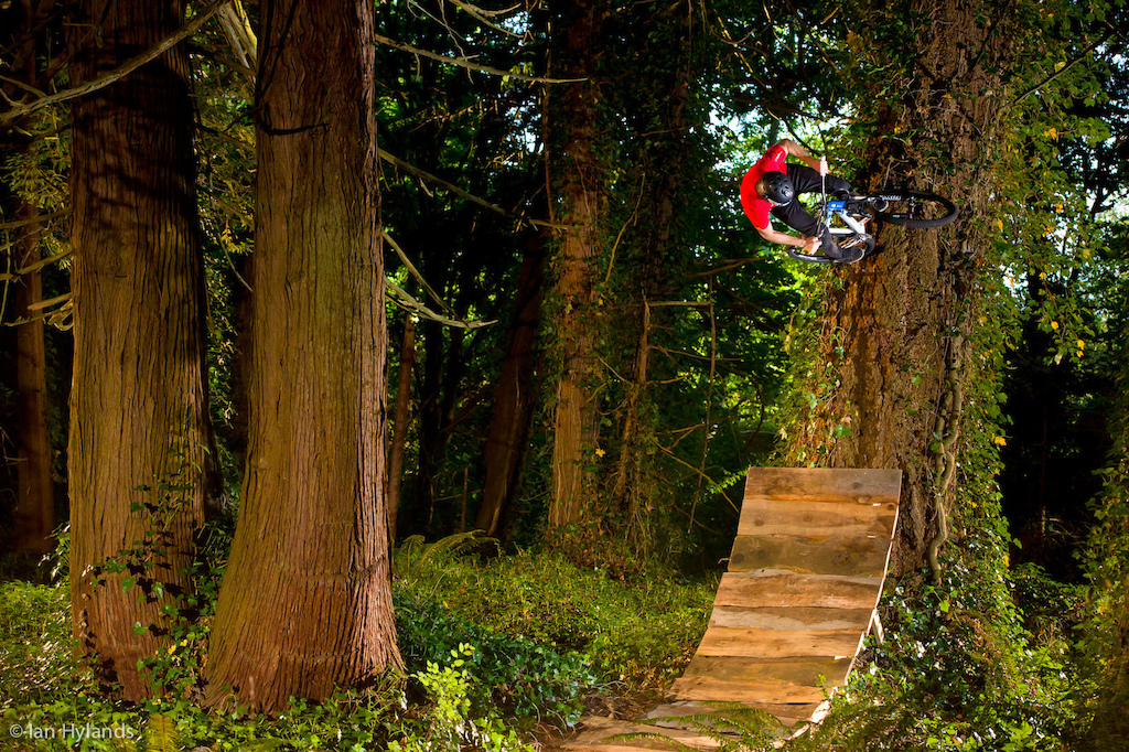Billy Lewis tire taps a tree in the enchanted forest somewhere in the Pacific Northwest.