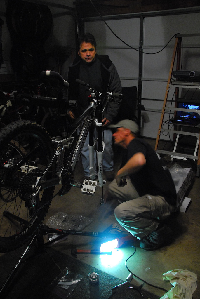 Pedalshop bike Techs wrenching on some of the Crews Rigs.
