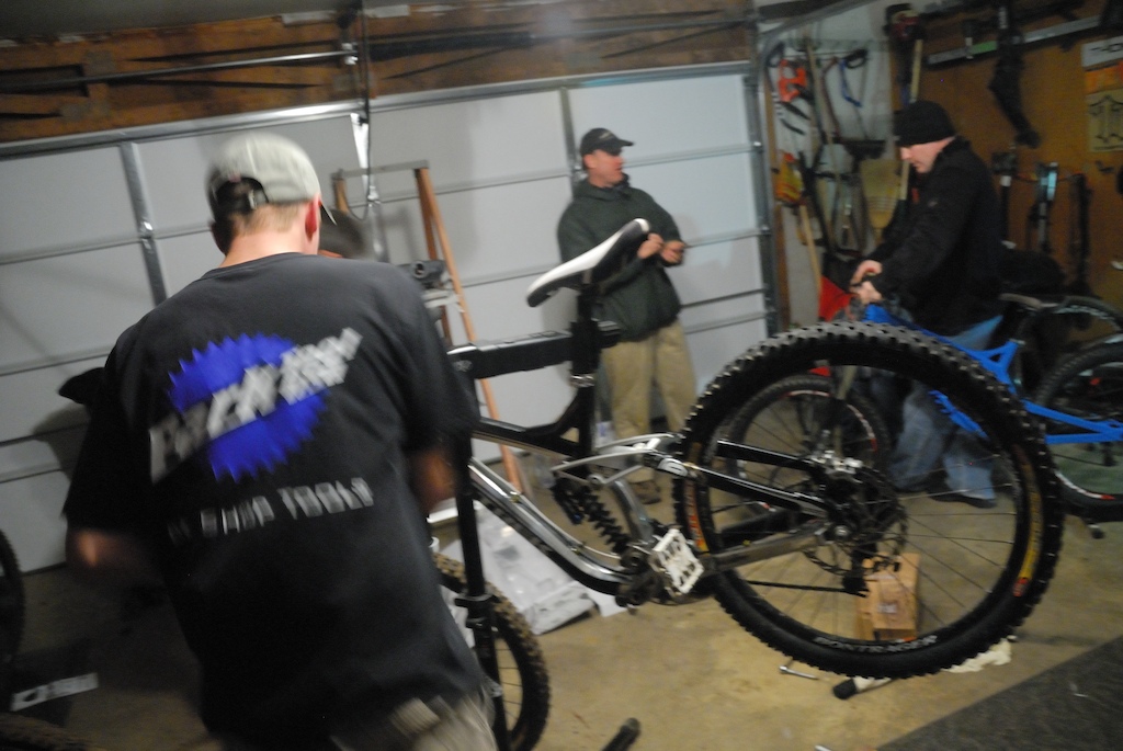 Pedalshop bike Techs wrenching on some of the Crews Rigs.