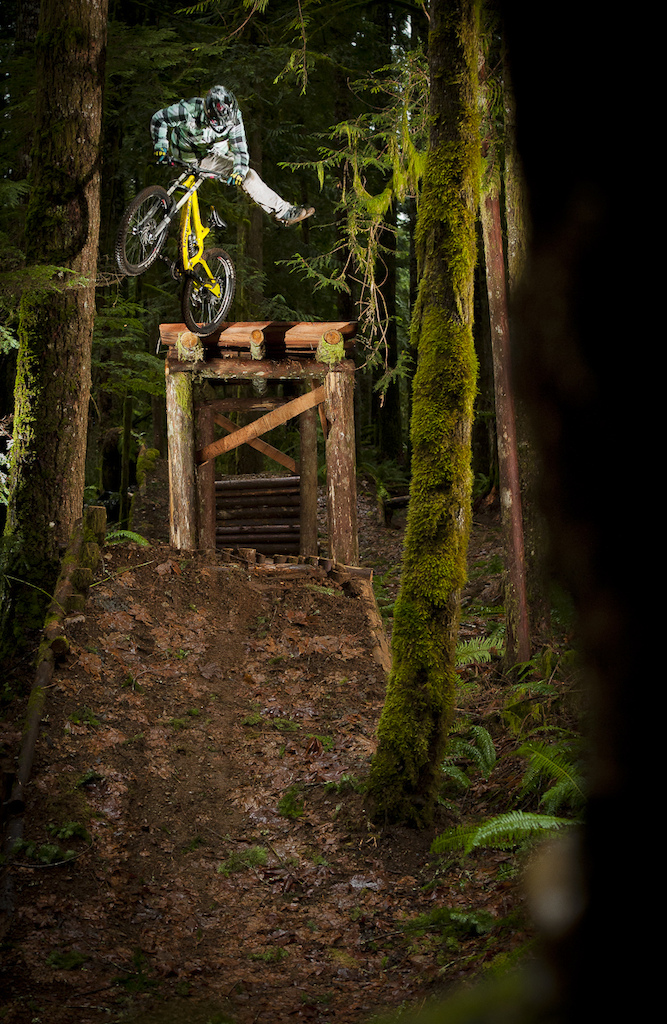 Eric Johnson lays down a massive no foot can off the drop. Burly trick on a DH bike in my book. © Paris Gore 2012