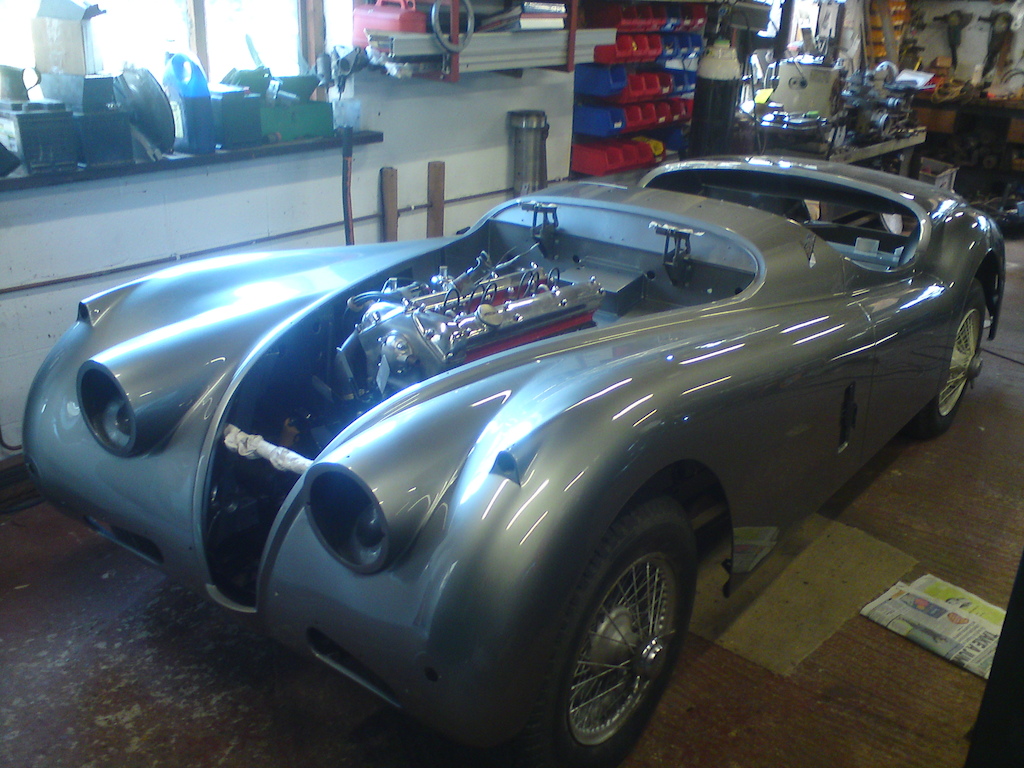 Next xk140 body been lowered over chassis front view.