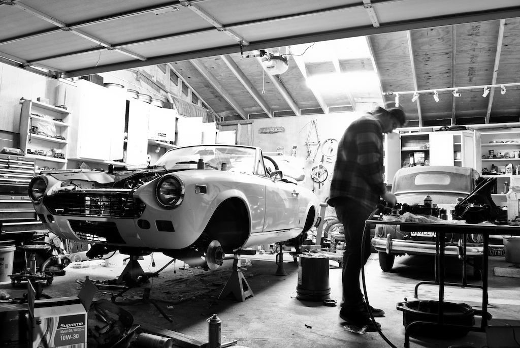 The Fiat 124 spider project just about. Heres a long exposure shot of the shop at night brother  installing the suspension and steering.