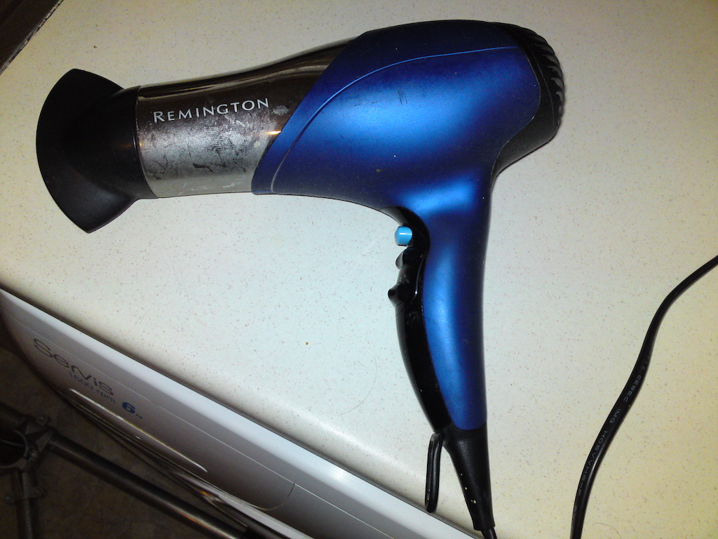 Trusty hairdryer....not for my curls but sealing the tape when applied.....Make sure you go across the tape for 15mins a tube, seal that glue/tape to the frame, airing out any minor air bubbles along the way/ If put on properly, air bubbles should be at a minimum, and with experience if you're lucky, not at all?