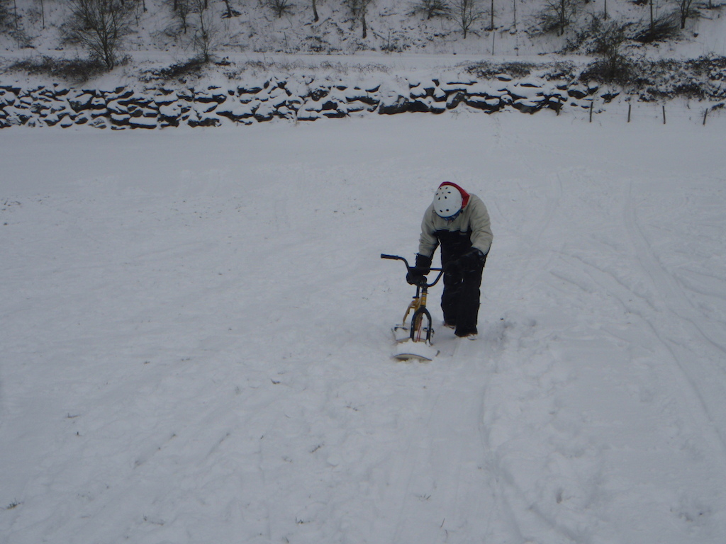 Ivan Bidegi going uphill with the snow-bike

http://afrotrailsclothing.blogspot.com/2012/02/afro-trails-goes-snow-biking.html