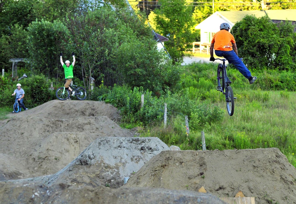 Photo by Jeb Wallace-Brodeur
Knight Ide rides a dirt jump line built in his back yard  in Newark.