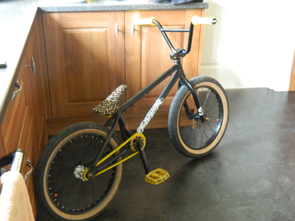 New: Yellow Shadow Conspiracy Interlock V2 halflink chain, Leopard print Bone Deth Vibrator Pivotal Seat, White WTP Frame Decal, Federal Slammed Pivotal Seatpost, A Bike Co. 25t Sprocky Balboa Sprocket and Gold annodized wheel nuts and stem bolts.