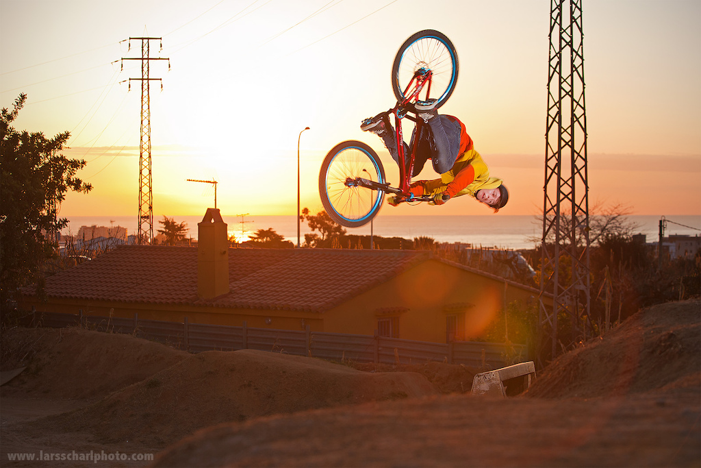 Photographer's dream: colorful sunrise over the Mediterranean Sea, perfect bikepark, a super motivated rider already at 7am and a nice steezy flair to top it off... awesome.

Antti Rissanen on Dartmoor two6player in La Poma Bikepark, march 2012.