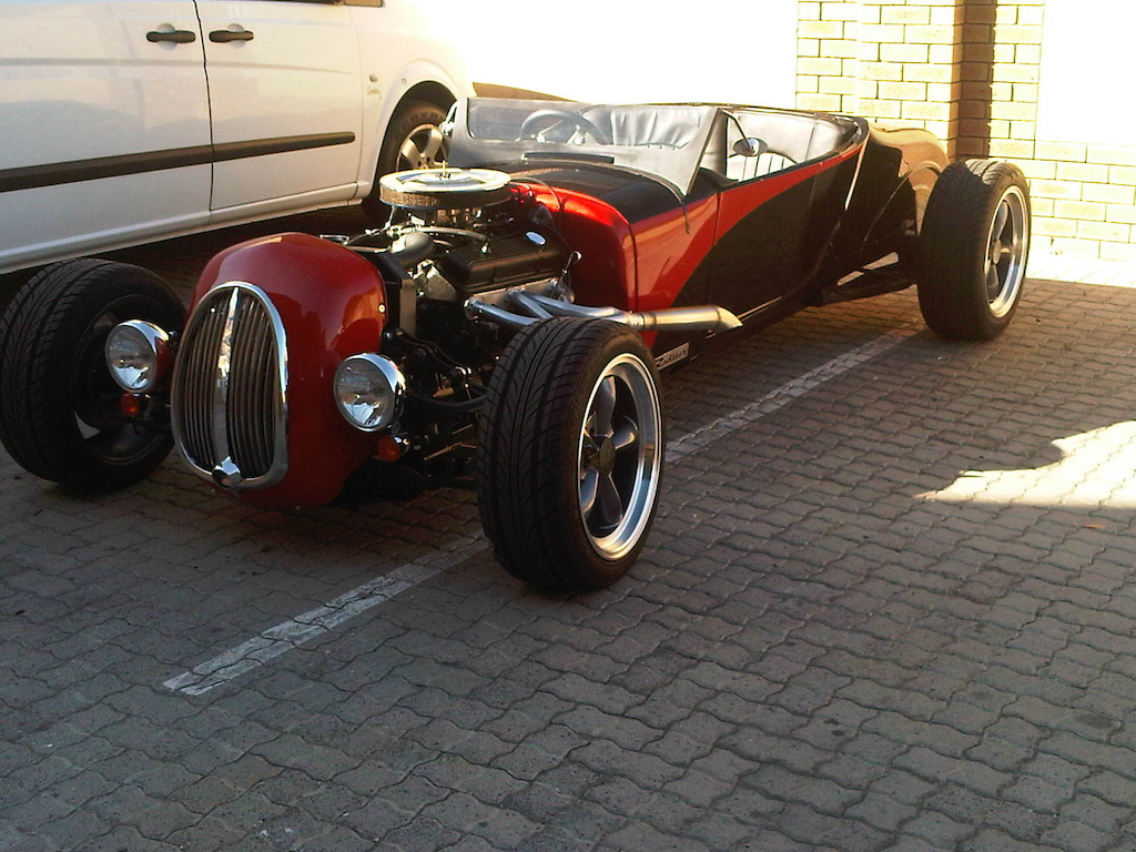 My Mate Karl built this. This is what he said.

The Radster is a ‘track T’ hot rod custom built by Creative Carversions. The body is a ‘glass replica of the Model T roadster by Miller. I have put on a track style nose popularized in the 50s when racing these cars. It sets the Radster apart from the ‘run of the mill’ style of Rods built in South Africa whilst still retaining a certain amount of nostalgic value.