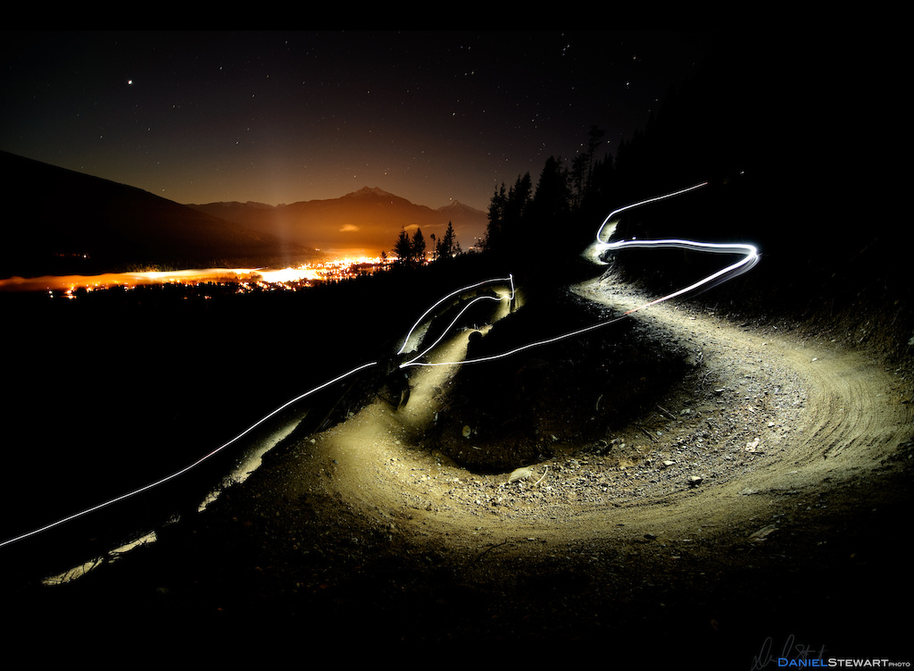 Stuart Dickson riding a new trail built in a cut-block at night on Boulder Mountain, Revelstoke, BC.