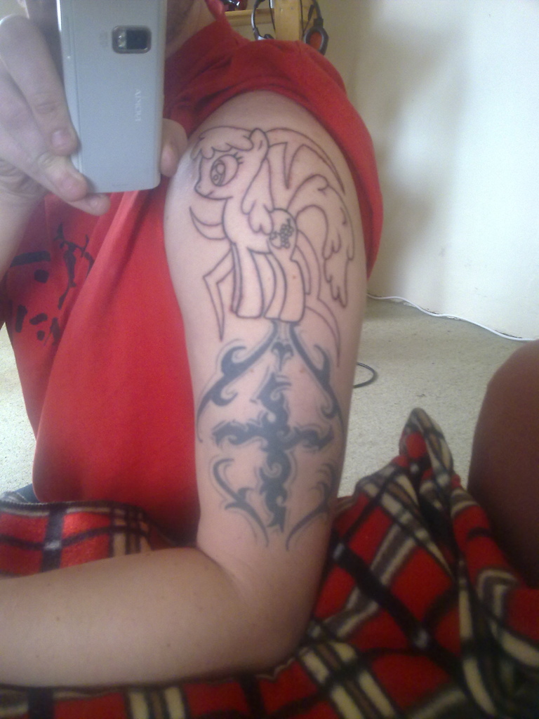 my new tattoo, getting the old tribal underneath redone soon.

I know its a MLP:FiM tattoo, so what, my body my rules, if you dont like it i dont care.