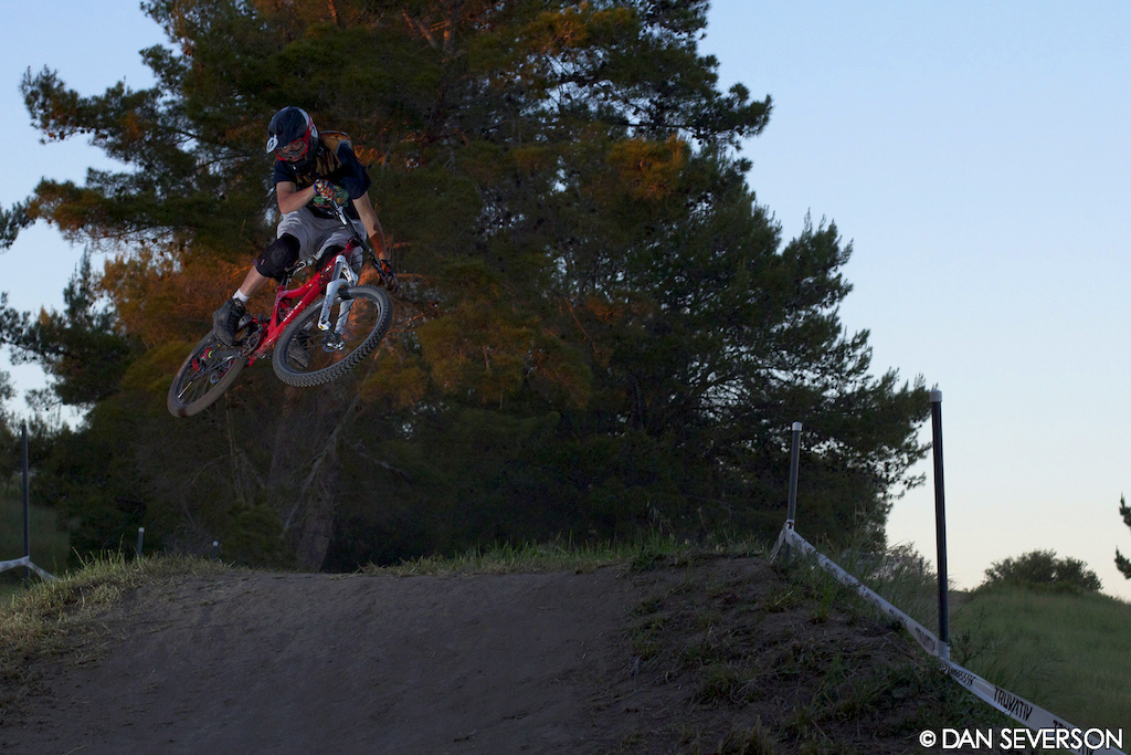 Friday evening at Sea Otter. A few riders were sessioning the jumps on the DH course right before dark.