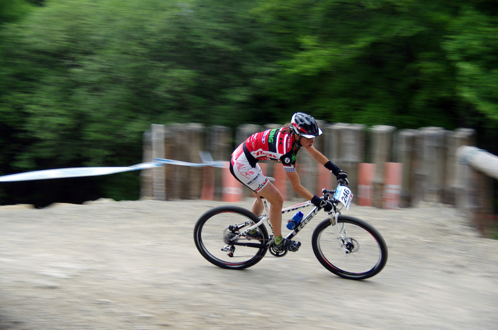 Sweeping shot of an XC rider on a corkscrew on the dalby 4x track