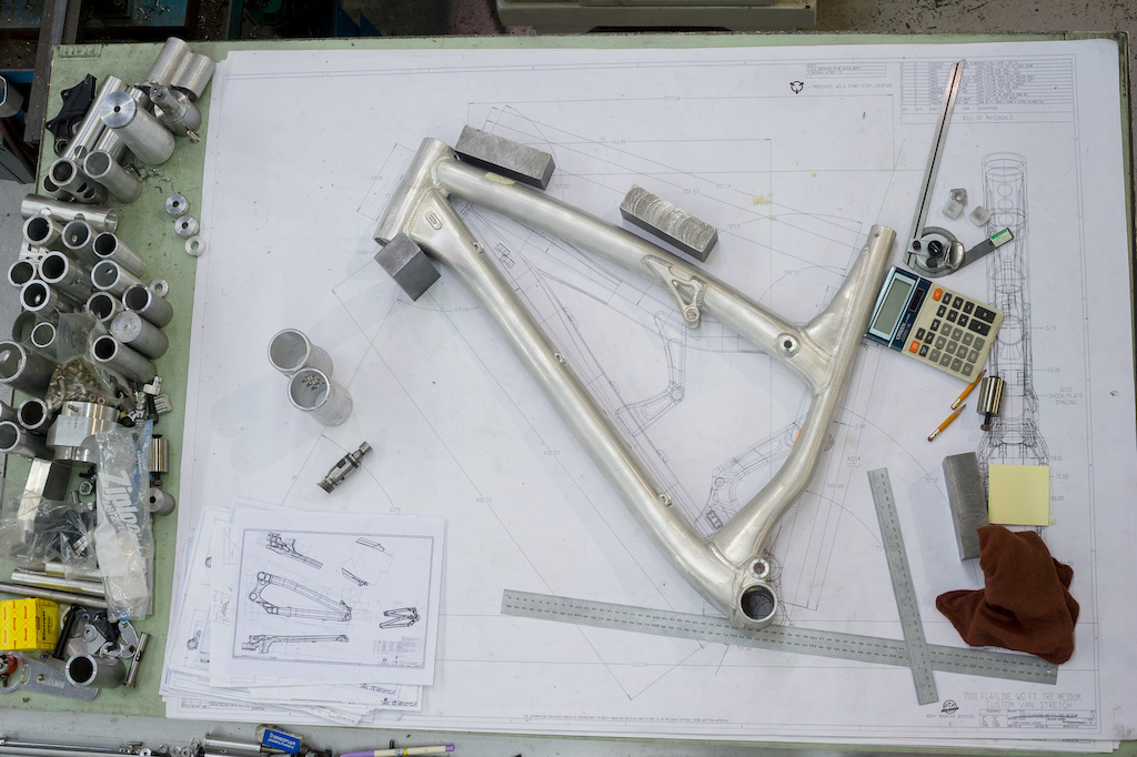A new frame sits on the table atop plans for a new custom Flatline being built up for Thomas Vanderham
