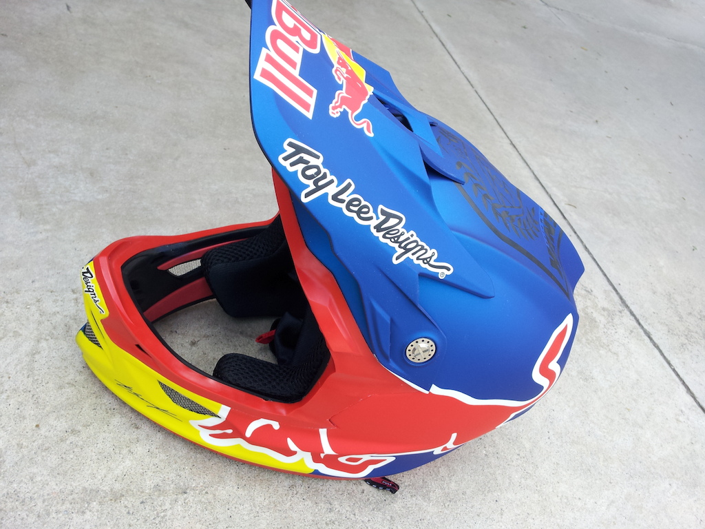 Brandon Semenuks new Troy Lee Designs D3  redbull paint job. We did a satin metallic blue finish, red trim, oversized red bull logos, and carbon 'semenuk' apparel logo on top (Brandons new TLD collection of apparel coming in fall 2012). Super sick.