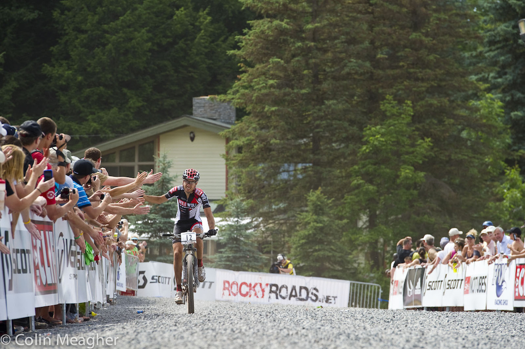 Sergio Mantecon Gutierrez of Spain showing appreciation for the fans coming out and cheering the riders on in the heat.