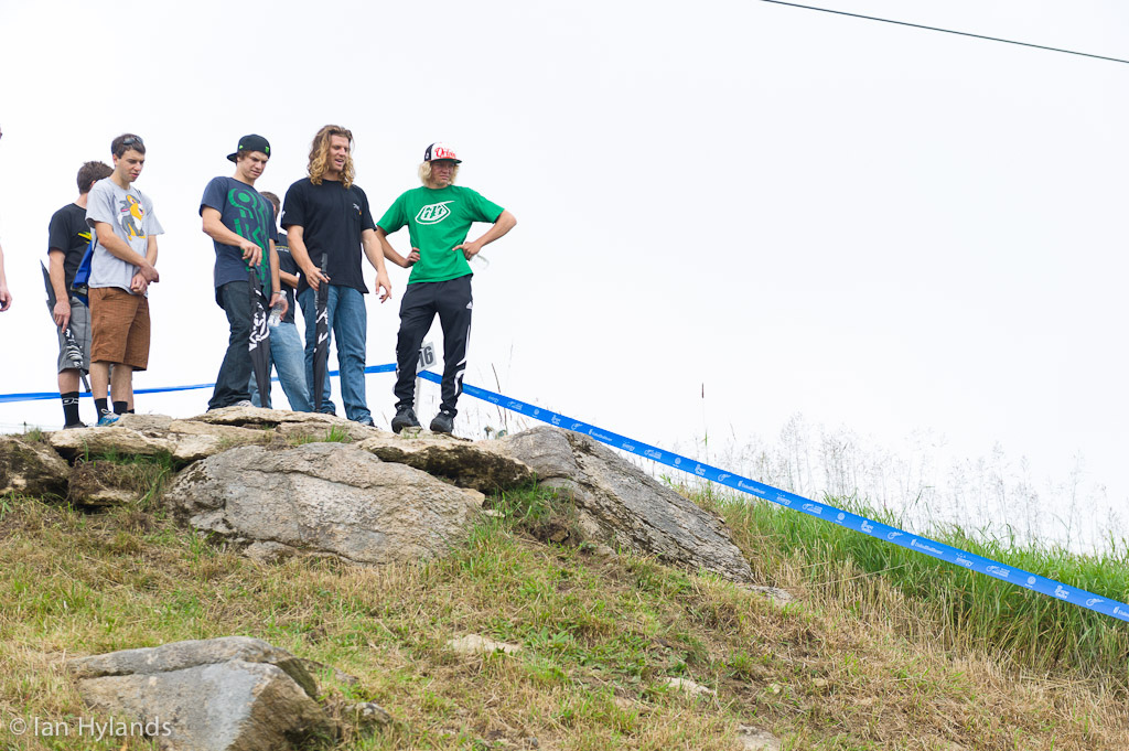 Mitch Ropelato, Brad Benedict and Cody Kelly check out the first real obstacle on the pro course, a small rock drop.