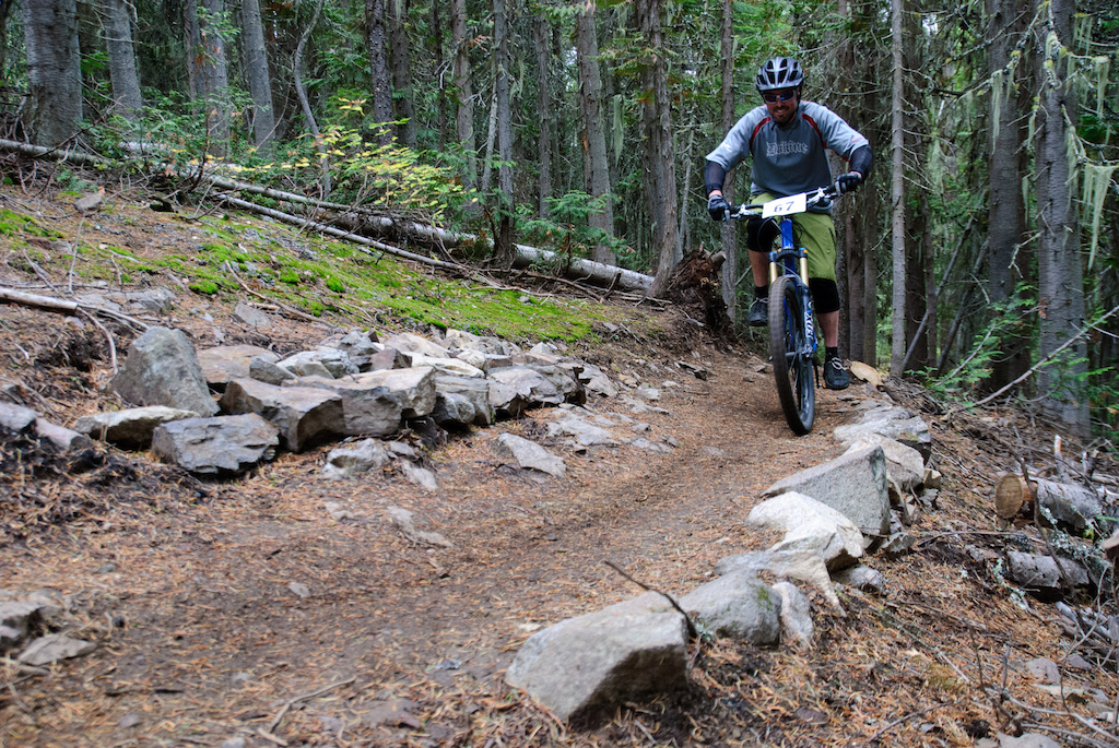 Brad's all smiles at the end of the climb and nearing the long, flowy descent on the Dreadhead Super D course. Event goes down Sept. 8 in Rossland, BC. Vince Boothe photo.