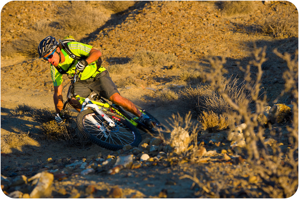 Richie Schley rides his bicycle near the Solosports Camp at Punta San Carlos Baja Mexico.