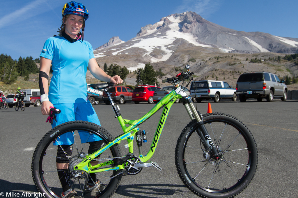 Jill Kintner shows off her 2013 Norco Range with 650b wheels with Mt. Hood in the background.  If it weren't for a flat in the rock garden of stage #4 Jill would have had a stellar weekend.