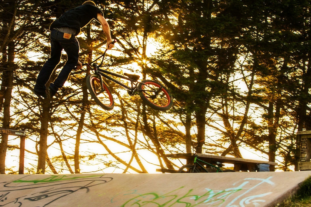 Jared throwing a nice tail whip off a bank