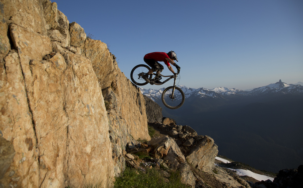 Mountain bike rider Dylan Sherrard flies through the air on the top of the world bike trail at the peak of Whistler mountain in Whistler B.C. Saturday August 11 2012. THE CANADIAN PRESS Jonathan Hayward
