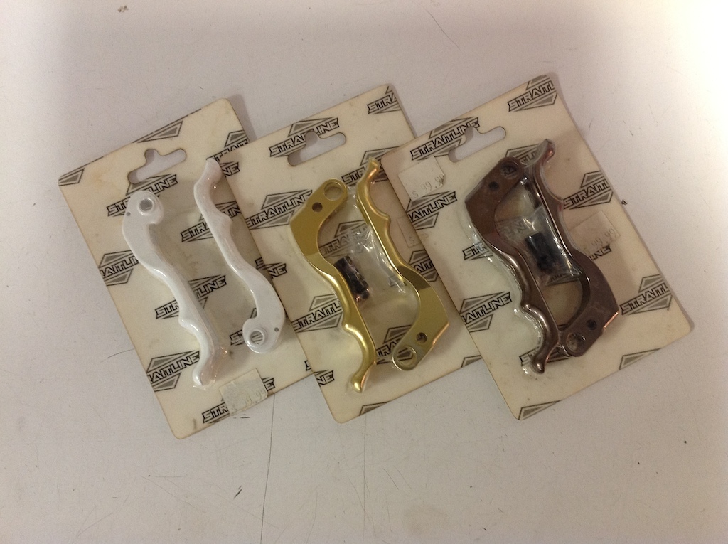 Straitline levers for sale. Half price at Rollin'; gold and bronze fit Juicys, white ones fit Codes.