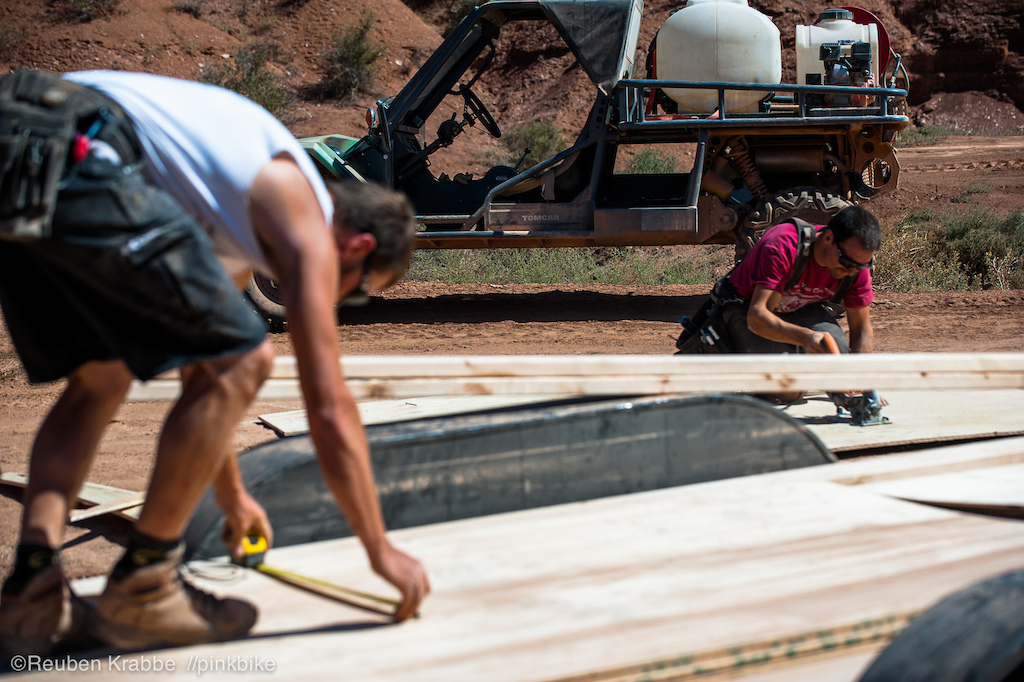 Jeremy head of the builders cutting wood for the lower mountain boaters