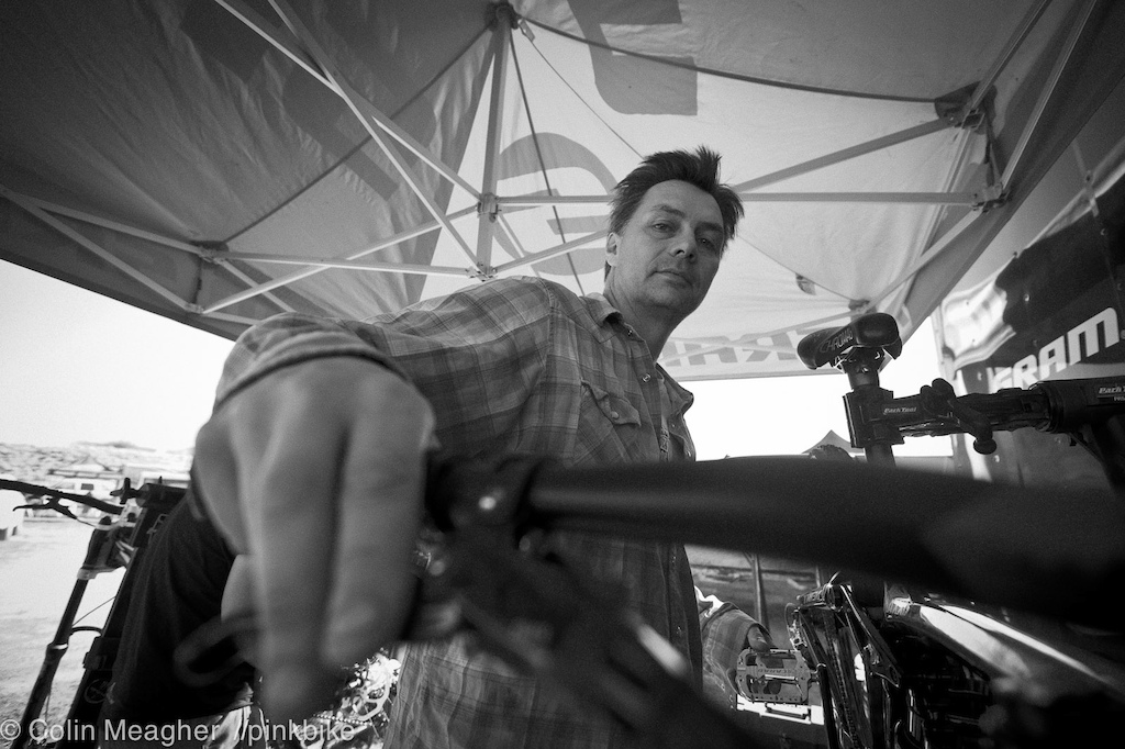 The Wizard Sean Cruickshanks working over Brandon Semenuk s bike in the pits.