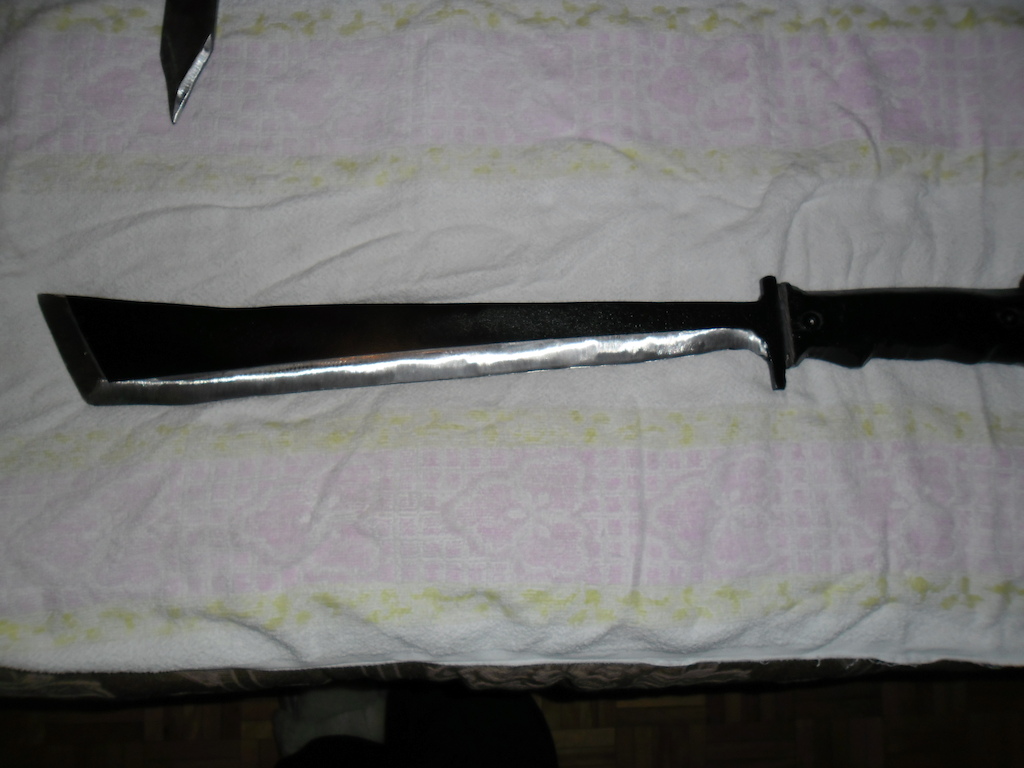My handmade  machete , 2.5lbs, sharp , very sharp , can cut thru bones