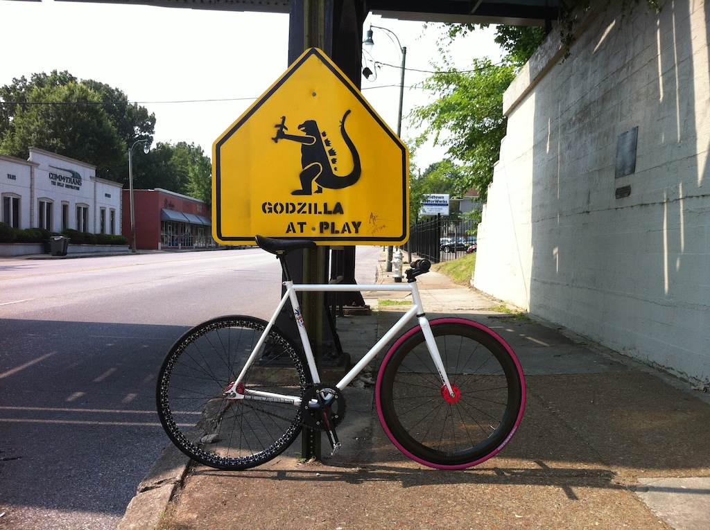 a few minutes before the start of a memorial day mix terrain ally cat in 102* temps. Which i won=) Some crafty person sprayed this stencil on a sign on Cooper St. in Midtown and since this frame is a Godzilla....well..you know