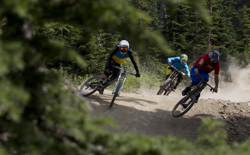 Mountain bike riders Paul Stevens, Dylan Sherrard and Seb Kemp are seen riding along a trail in Whistler, B.C. Monday, August 13, 2012. THE CANADIAN PRESS/Jonathan Hayward