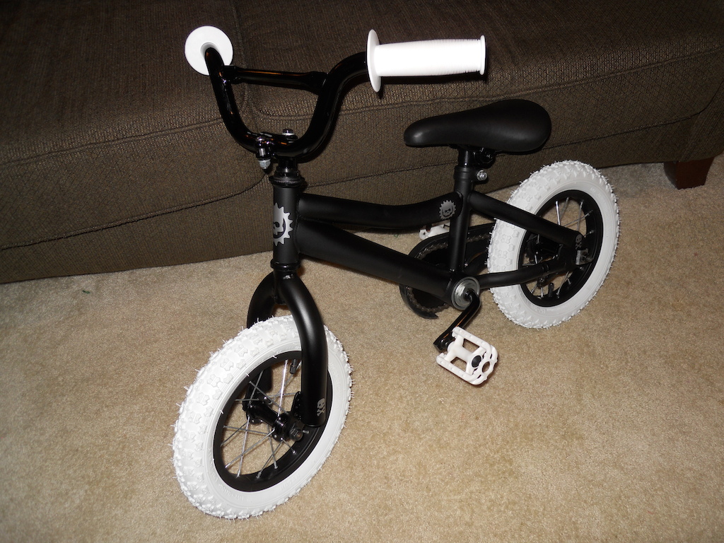 Recycled from kid 1 to kid 2. New tires, seat, grips, pedals. Dope ass paint, some skulls and Voila! Pirate bike!