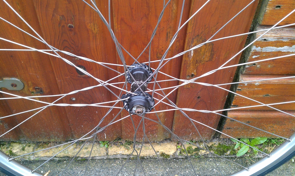 28" hybrid wheels with Deore LX hubs and "Twisted Spokes". Comes with tyres but NO cassette.