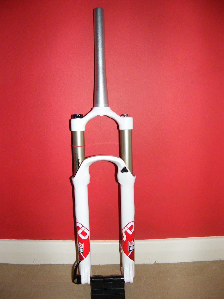 Rock Shox SID RL Dual Air fork with tapered steerer, 120mm travel, and 15mm Maxle.