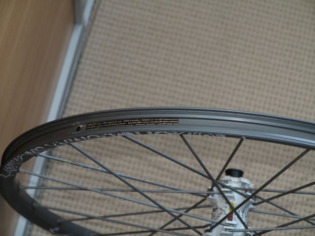 Rim profile, sticker tells you the recommended pressures and tyre widths.
