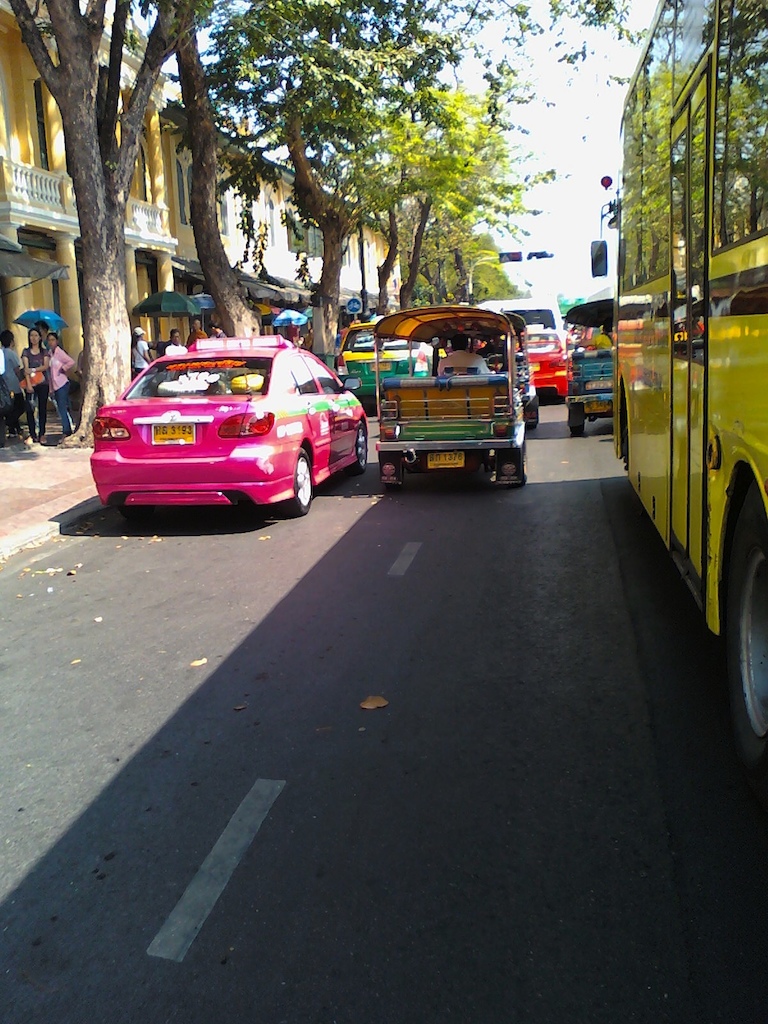 Typical traffic scene, bus and taxis