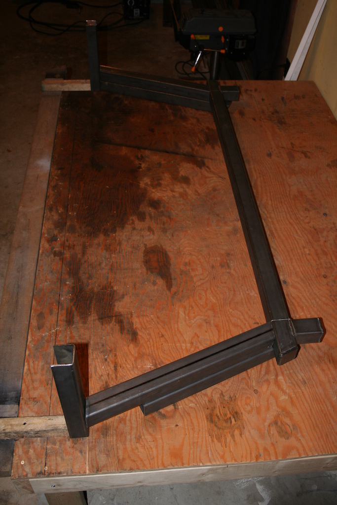 The rear rack will bolt on to the top rail at the back of the box.