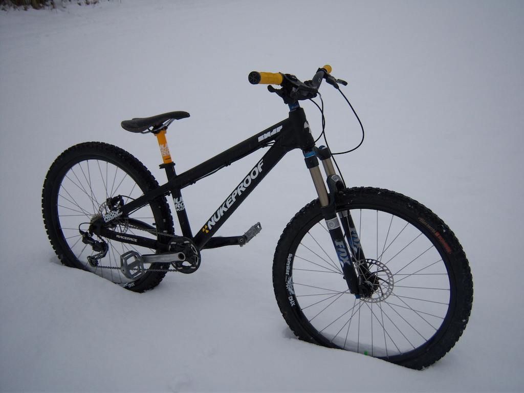 The Nukeproof Snap sitting in the snow 4X Hardtail