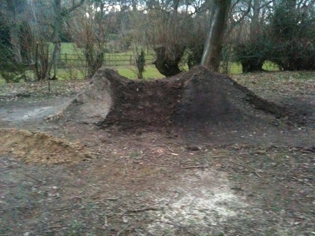 side view of my big dirt jump i filled in the middle so i can make the landing a little closer to the jump.