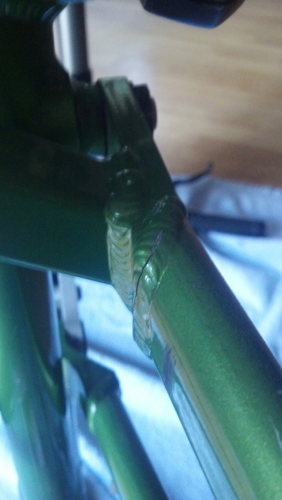 Crack on the inside of the swingarm, towards where it meets with the pivot.