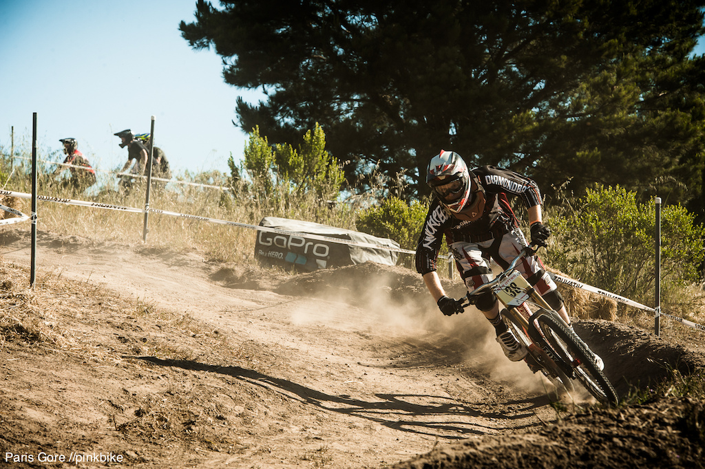 Diamondback's Kyle Thomas rips into the first corner of the course. It's hot, loose and dusty.