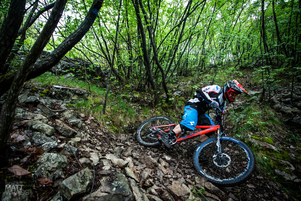 Cornering hard in loose, rocky conditions.