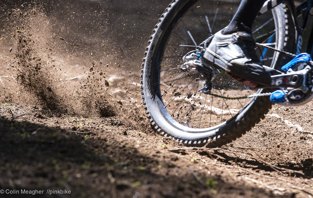 Roosty goodness courtesy of Andrew Neethling. As predicted as the pine needles were scoured off the track the loamy dirt started offering all kinds of roost opportunities. Steve Smith evidently hit one corner hard enough to feel the roost smacking the back of his helmet.