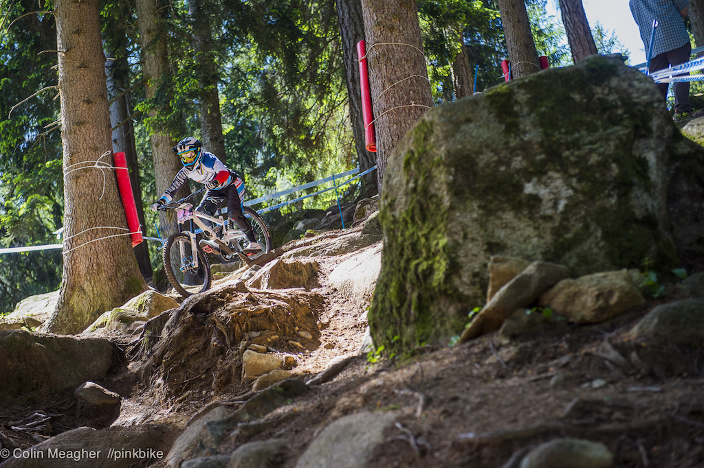 It s all about line choice in the rock garden. There definitely IS a main line but when 312 riders storm the course lines change. The rock garden in particular saw some evolution as a pair of bomb holes developed below the stump dead center of the frame--the main line. Riders like Ragot were quick to finesse a rock rider s right of hte stump to skip over the bombholes.