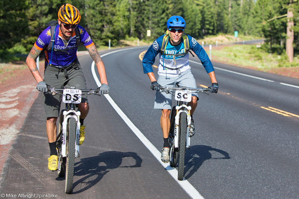 Damien Schmitt and Scotty Carlile performing the ultimate rider psych-out, riding to the top when other are shuttling.