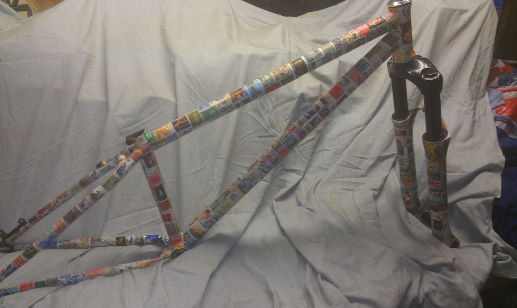 Crappy pic of my frame that I covered in a ton of international stamps to match my fork. Will get better pictures when I build the bike up.