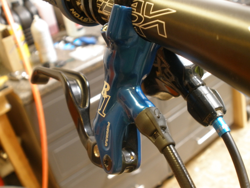 More brakes you cannot get. Blue ano levers mated to T1 calipers with blue ano piston caps.