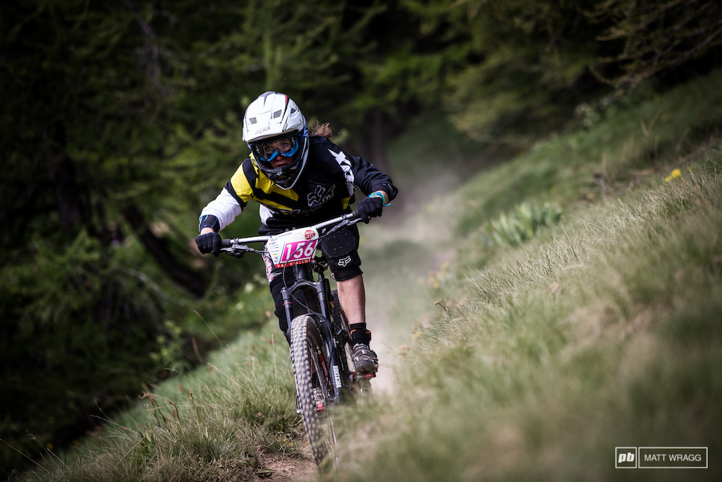 Giant s Kellie Emmett keeping it tucked through the long grass of the high alpine meadows.